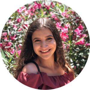 2019 Summer Interns leslie torres standing in front of the flowers